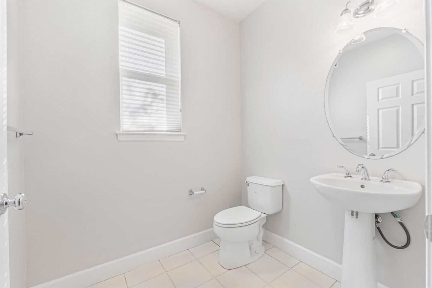 2102 Klassen Way San Jose, CA 95131 - Photo 10 of 31 a bathroom with a toilet a sink and mirror