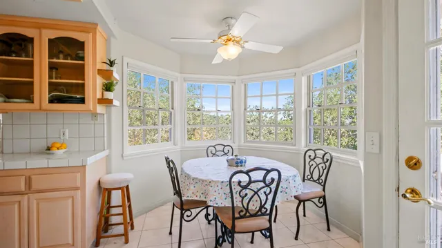 a dining room with furniture and window