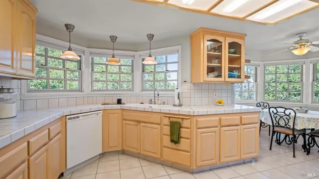 a view of a kitchen with appliances and cabinets