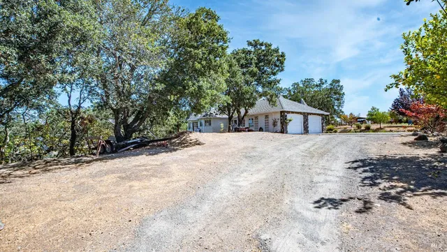 a view of a house with a snow on the road