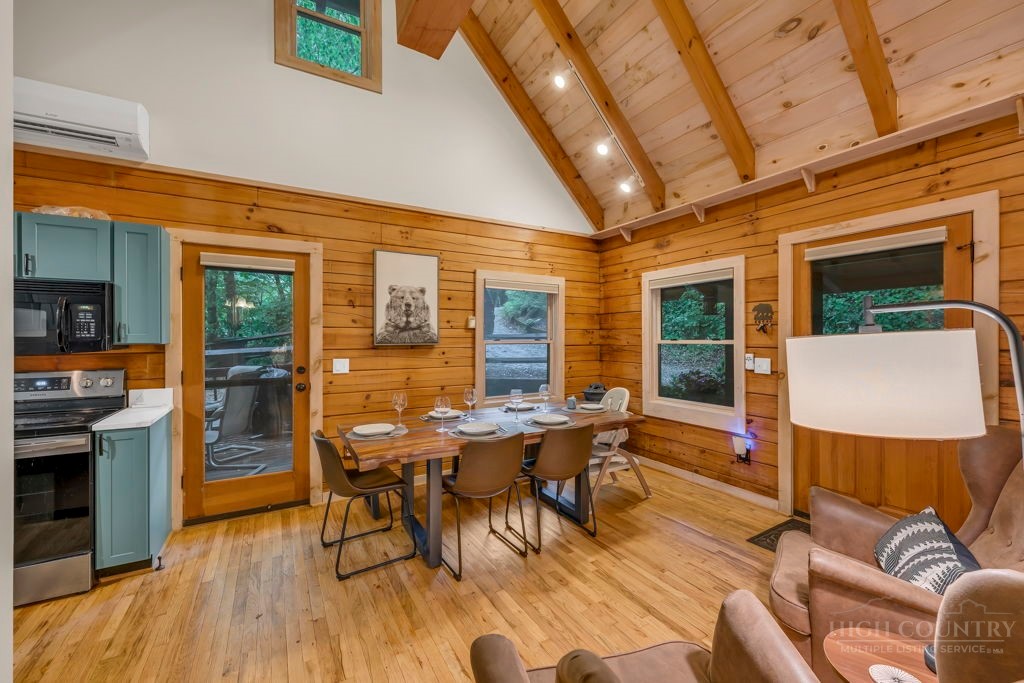 192 Dewitt Barnett Road Vilas, NC 28692 - Photo 11 of 32 a view of a dining room with furniture window and wooden floor