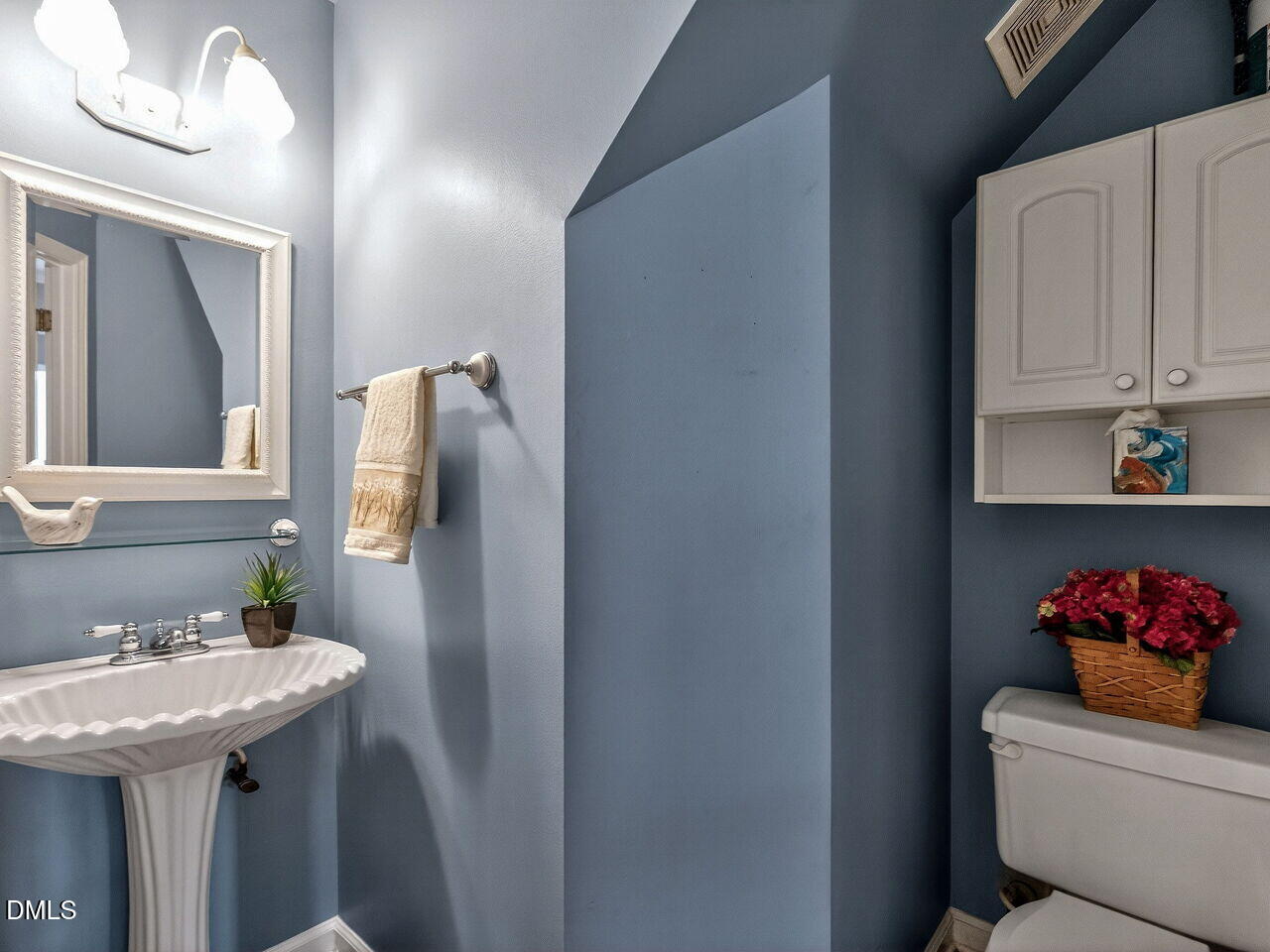 4500 Rivershyre Way Raleigh, NC 27616 - Photo 17 of 42 a bathroom with a sink and a mirror