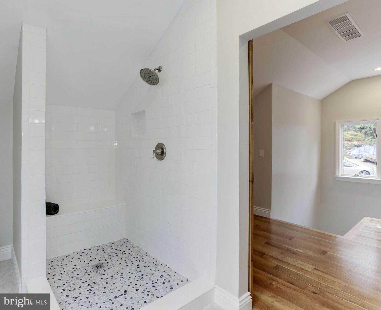 1703 Robinhood Road Annapolis, MD 21401 - Photo 21 of 58 Custom pebble flooring and roomy shower w/bench.