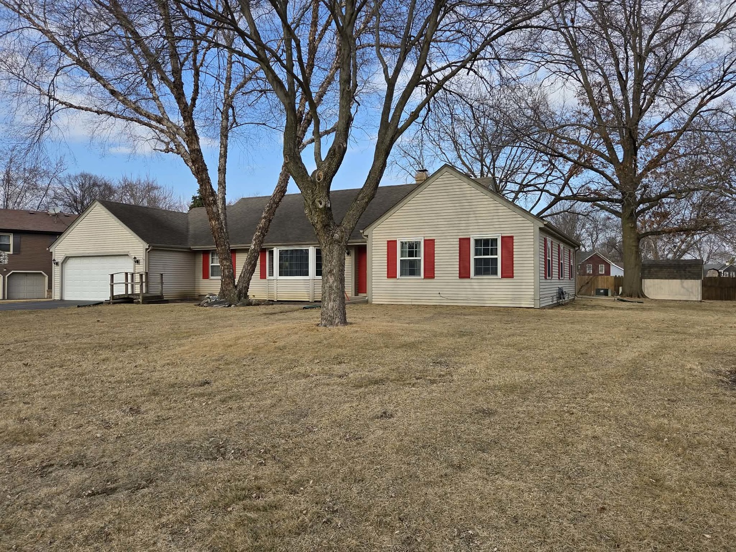 1092 Woodland Hills Road Batavia, IL 60510 - Photo 3 of 3 a front view of a house with a large tree