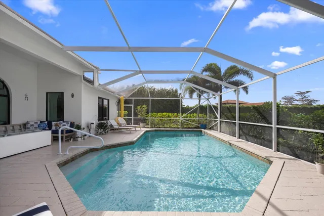 a view of a backyard with a tub and wooden fence