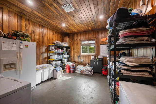 a view of a room with lots of wooden furniture
