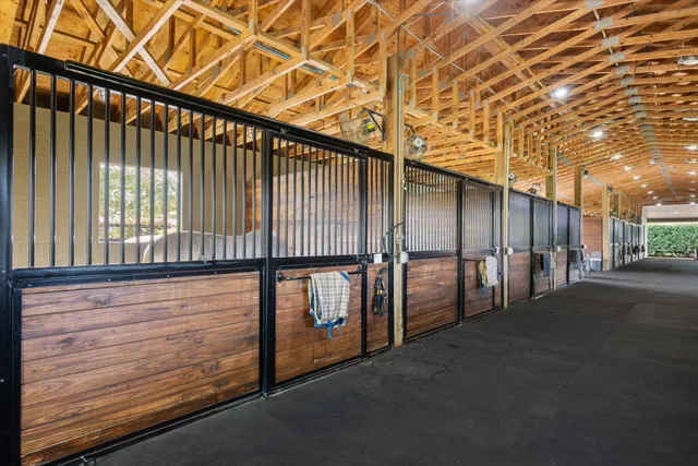 a bedroom with a bed and a mirror