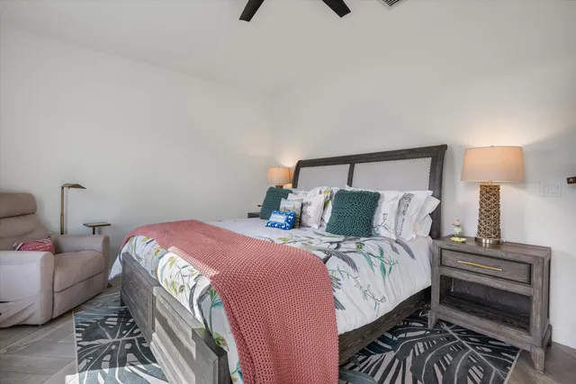 a bedroom with a bed and a television