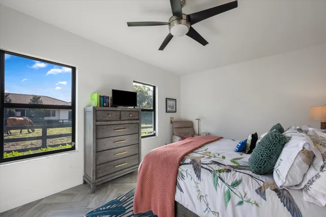 a bedroom with a large bed and a tv
