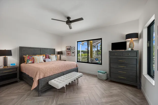 a bed room with a bed and a chair