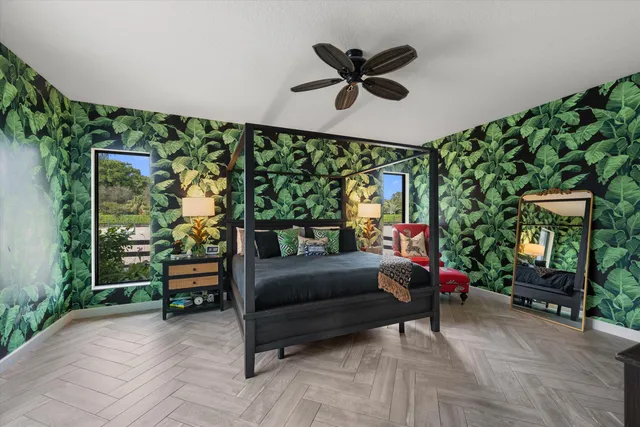 a large kitchen with stainless steel appliances granite countertop a lot of counter space and wooden floor