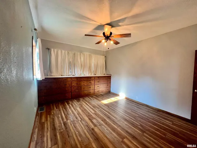 a view of yard with large trees