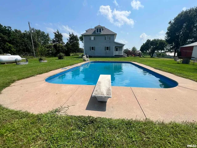 an aerial view of a house with a garden