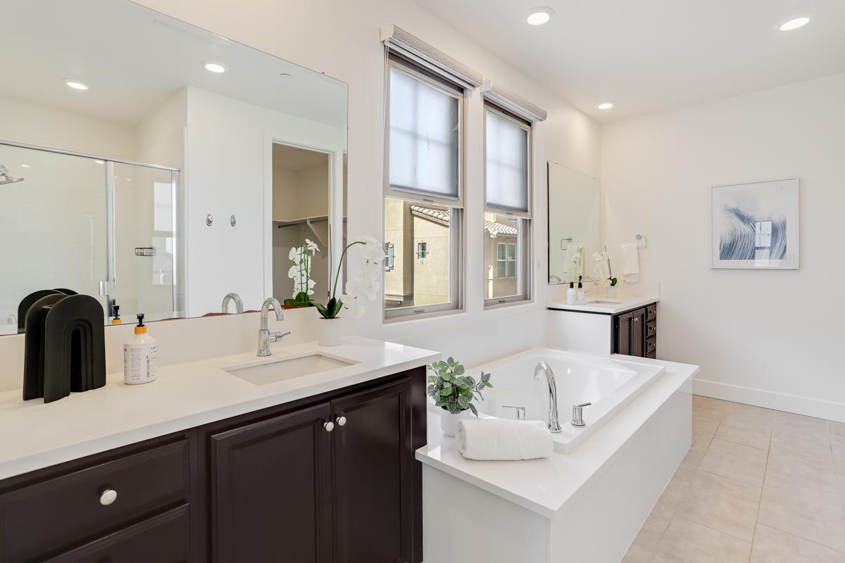 14 Catania Common Fremont, CA 94536 - Photo 20 of 39 a spacious bathroom with a double vanity sink a mirror and a bathtub