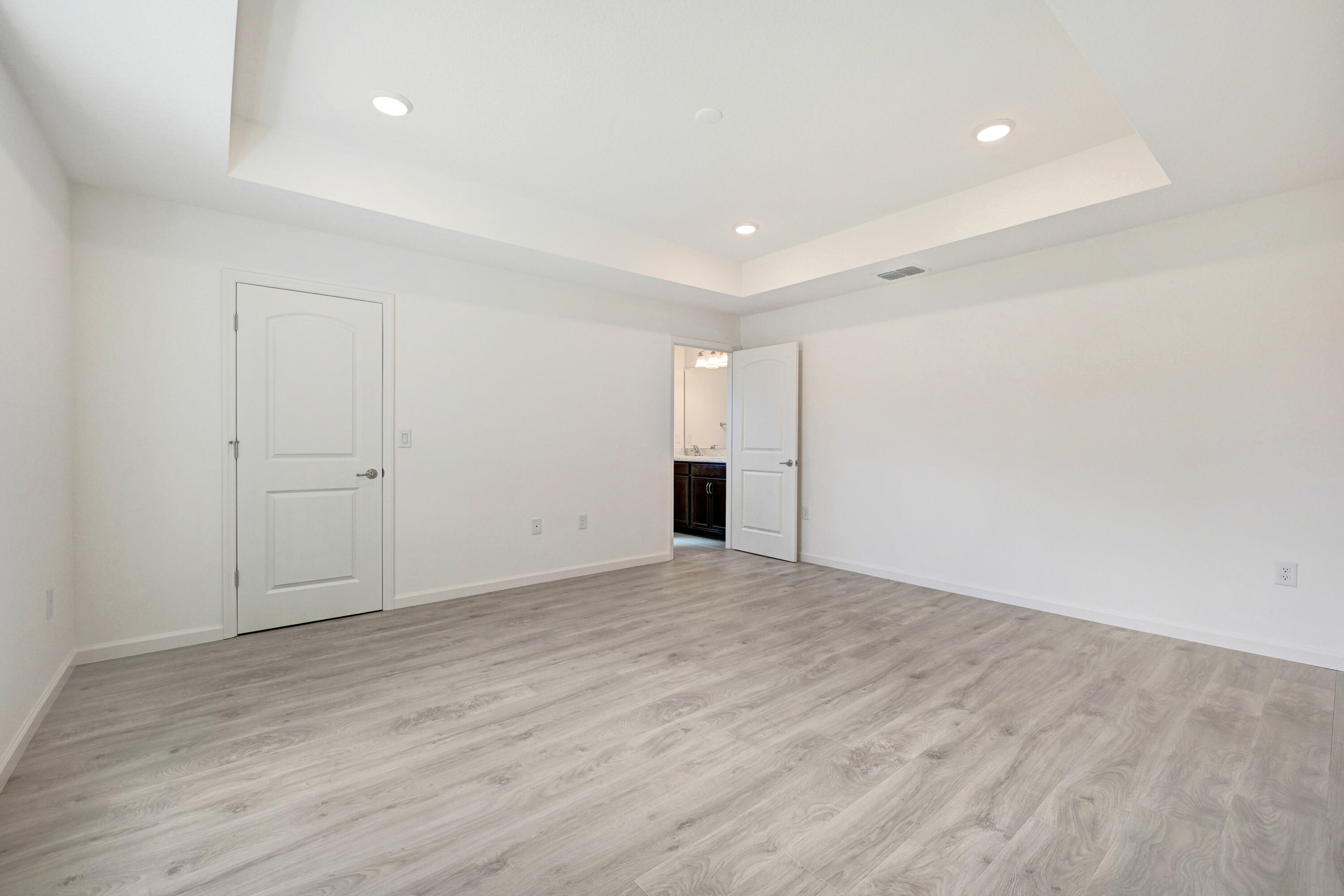 239 Trilby Road Southwest Palm Bay, FL 32908 - Photo 18 of 38 Primary Bedroom with Tray Ceiling
