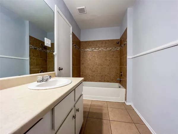 a bathroom with a sink a bathtub and a shower