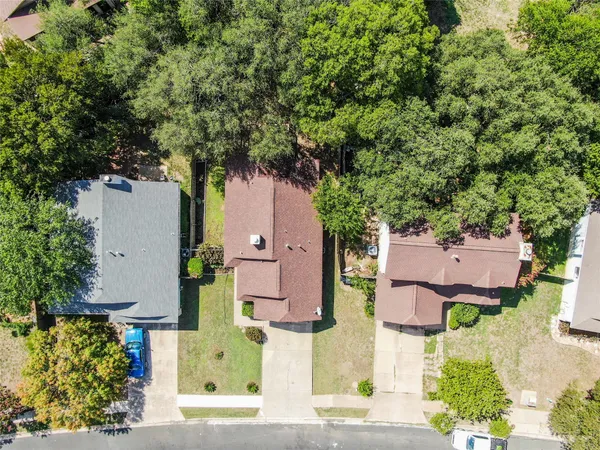 an aerial view of houses with yard