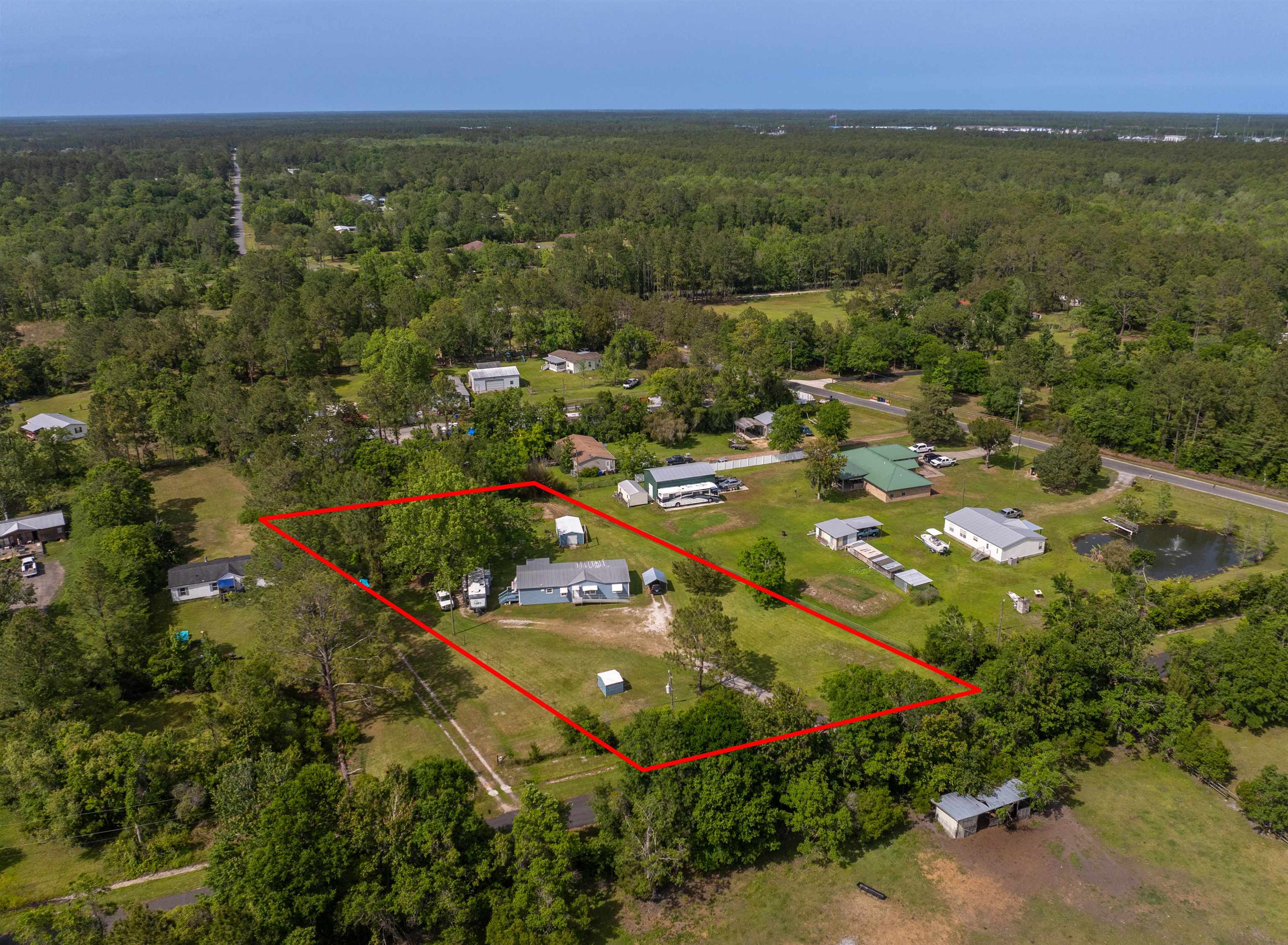 3140 Raulerson Road East St. Augustine, FL 32092 - Photo 16 of 23 an aerial view of residential houses with outdoor space and trees