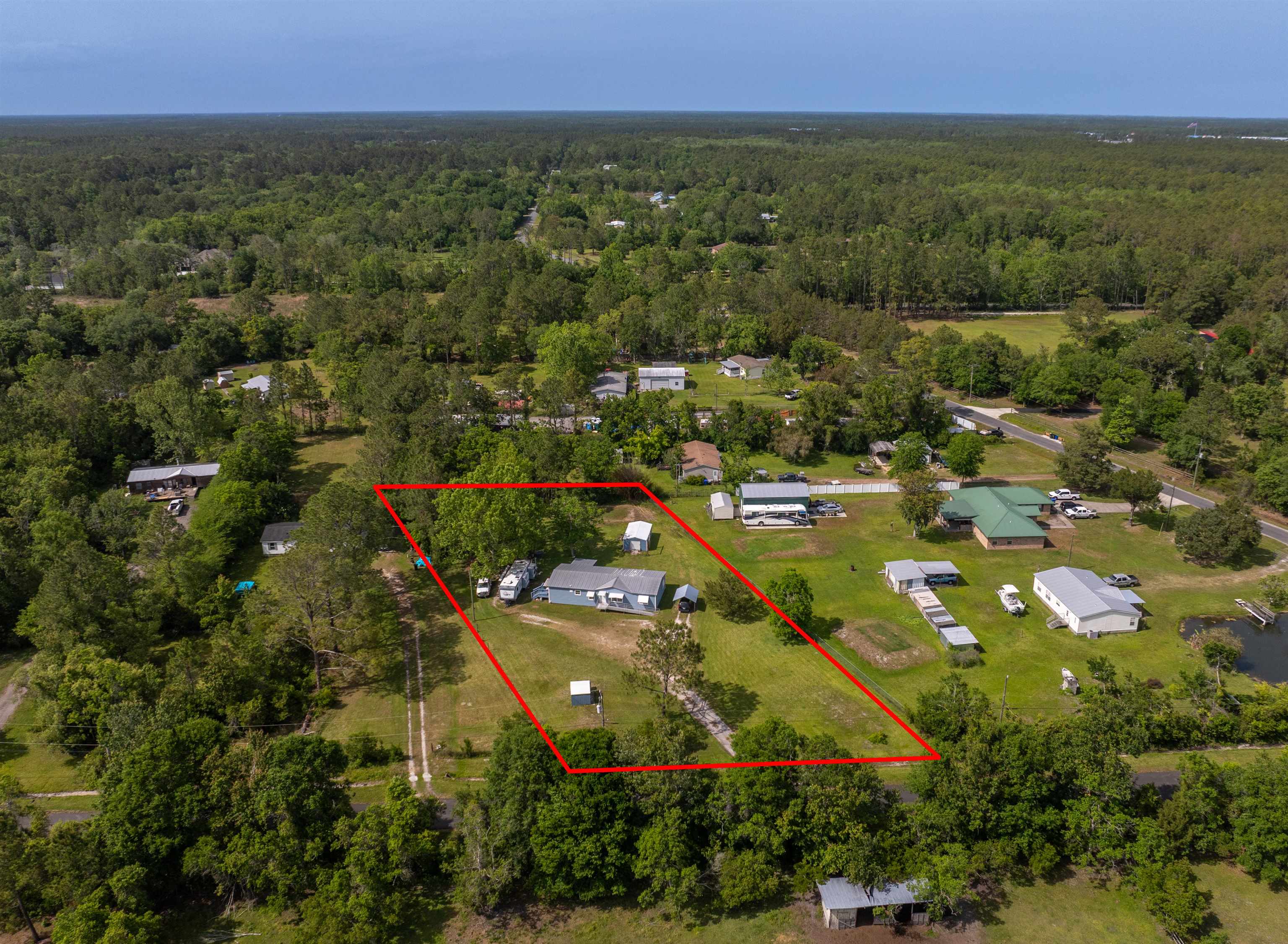3140 Raulerson Road East St. Augustine, FL 32092 - Photo 17 of 23 an aerial view of residential houses with outdoor space and trees