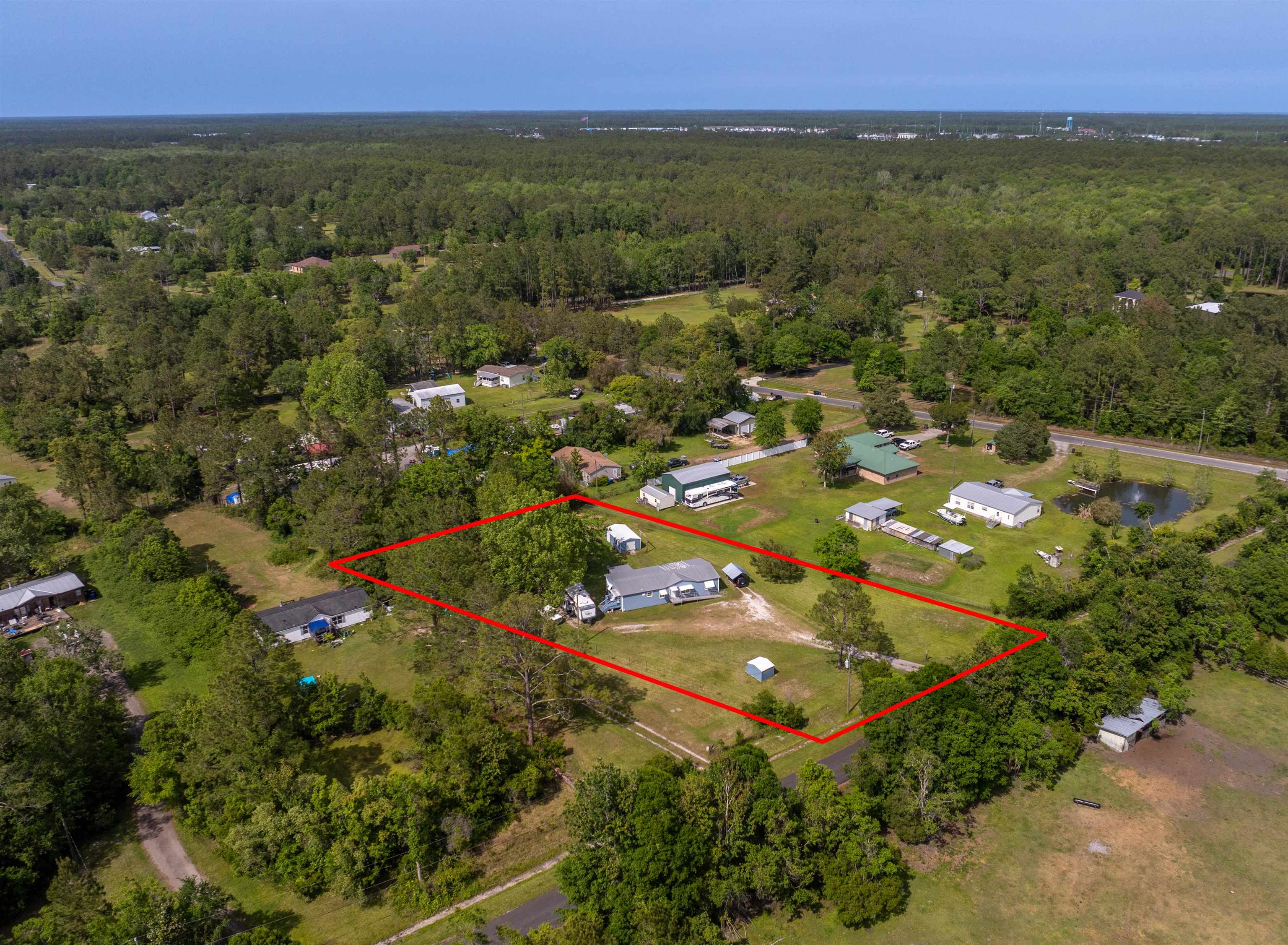 3140 Raulerson Road East St. Augustine, FL 32092 - Photo 23 of 23 an aerial view of residential houses with outdoor space and trees