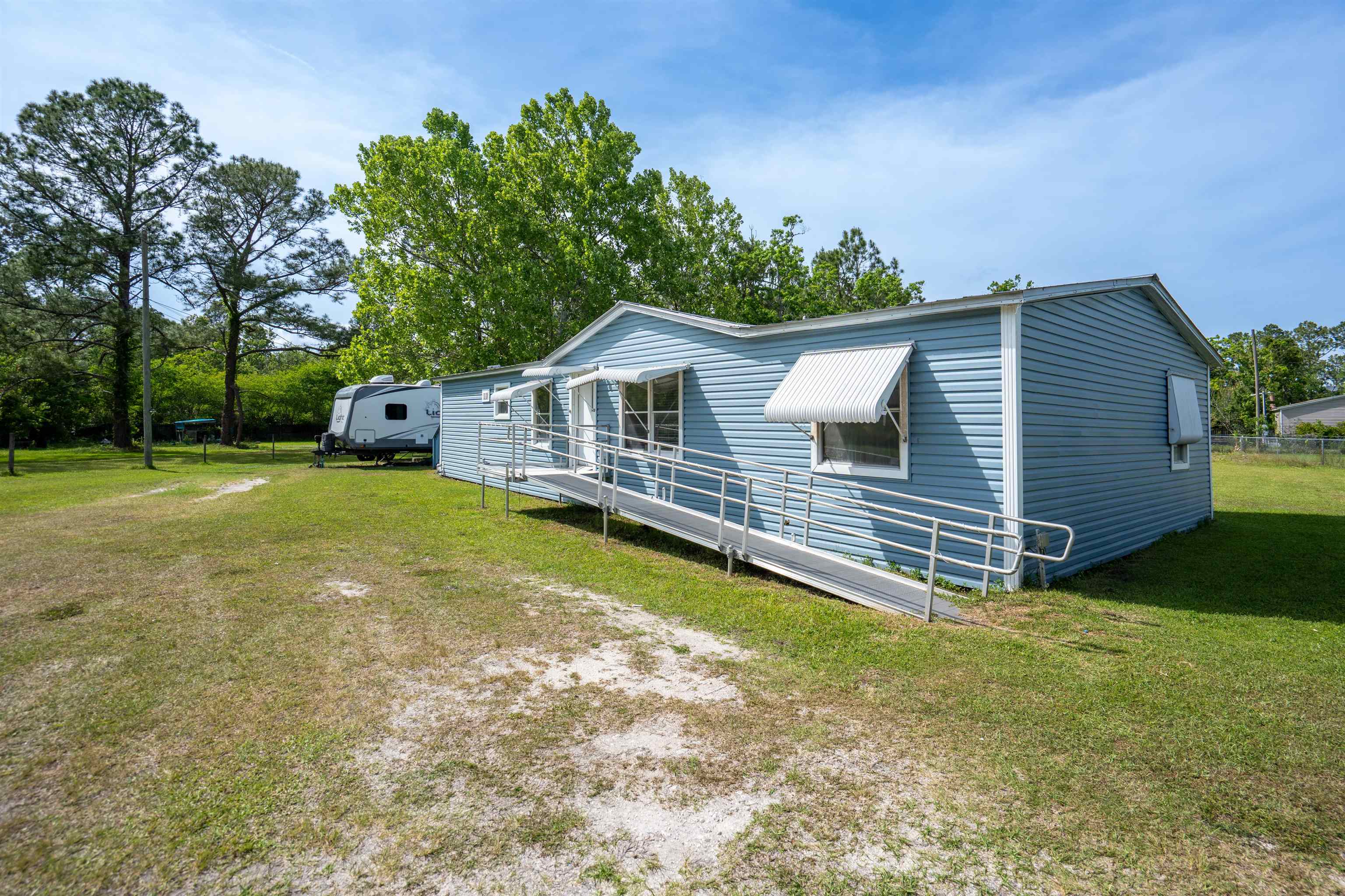 3140 Raulerson Road East St. Augustine, FL 32092 - Photo 4 of 23 a view of a house with a yard