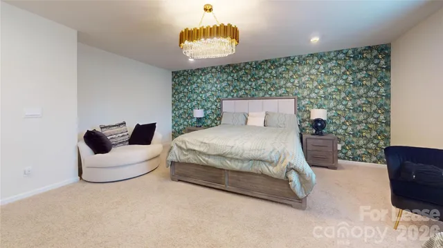 a bedroom with a bed and a couch