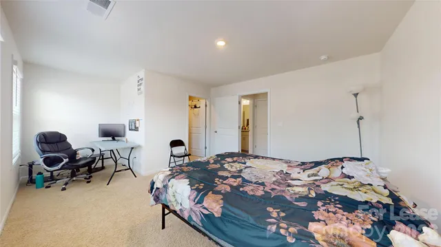 a bathroom with a toilet a sink and a mirror
