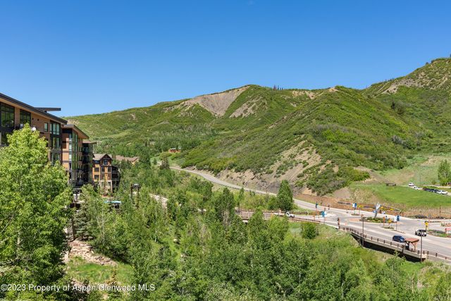 a view of a lush green space with sea