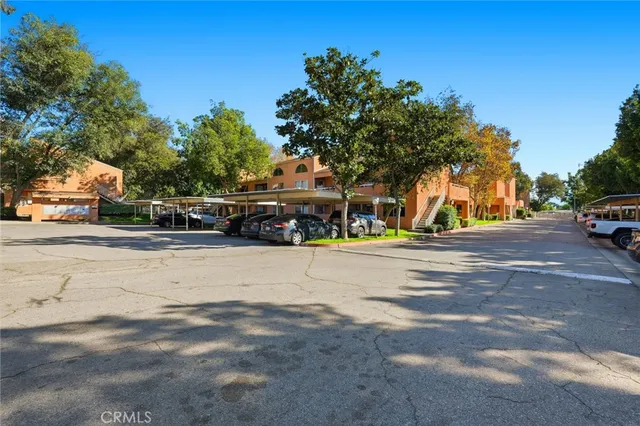 a view of house with outdoor space and parking