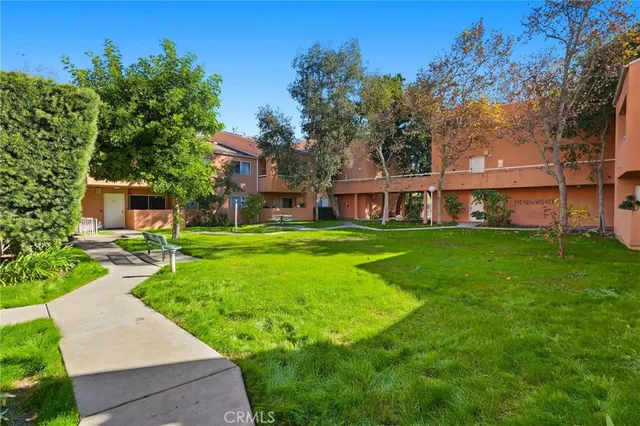 a view of a house with a yard porch and sitting area