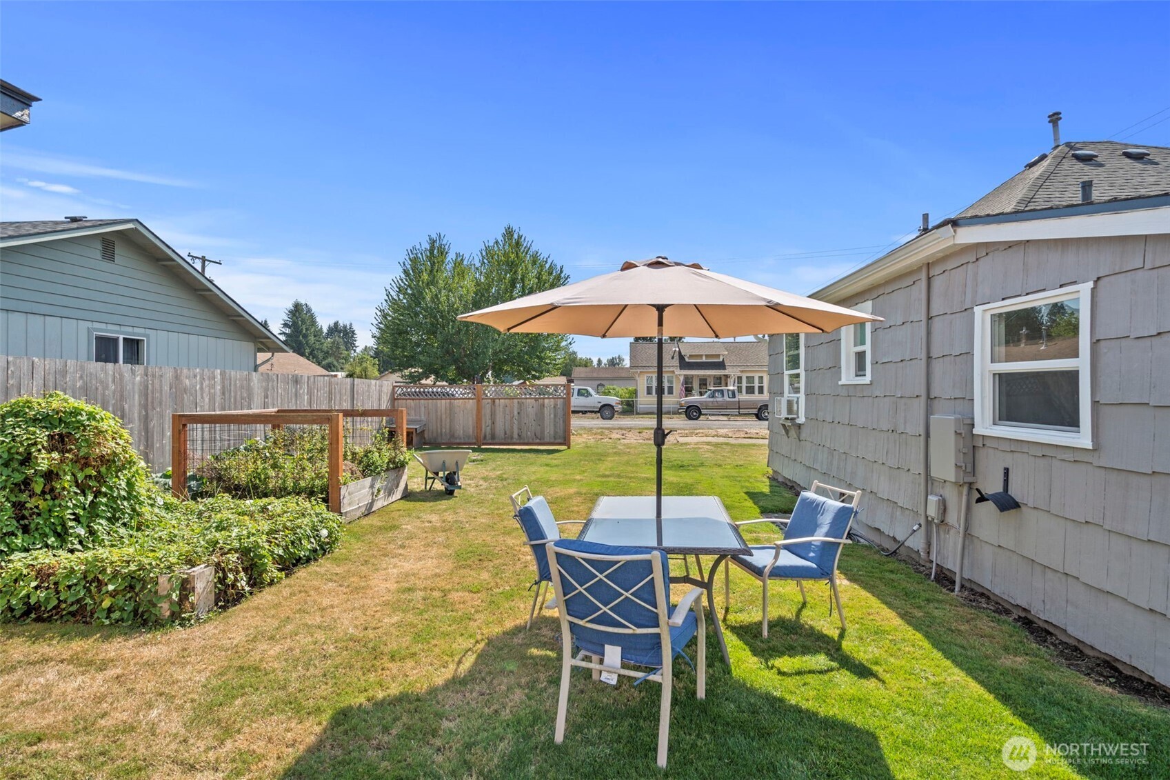 450 Cedar Street Toledo, WA 98591 - Photo 21 of 38 a view of a house with backyard sitting area and swimming pool