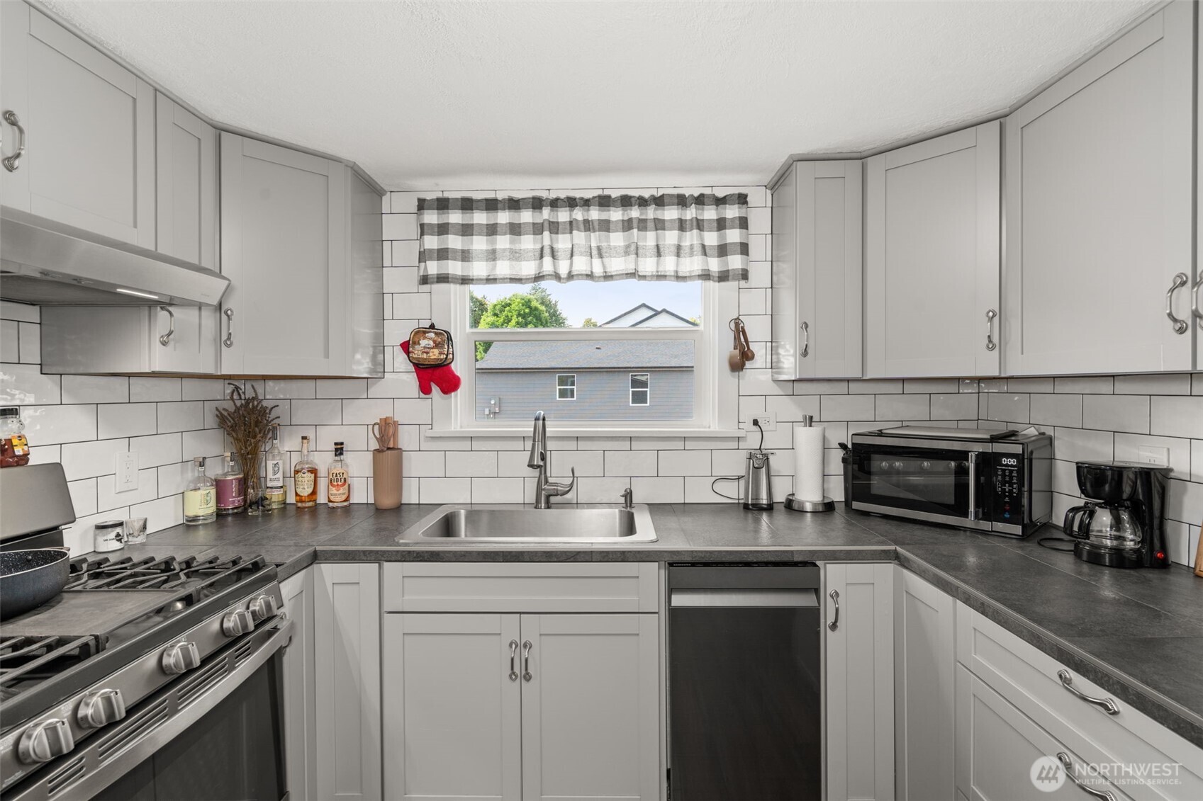 450 Cedar Street Toledo, WA 98591 - Photo 34 of 38 a kitchen with stainless steel appliances a sink a stove and cabinets