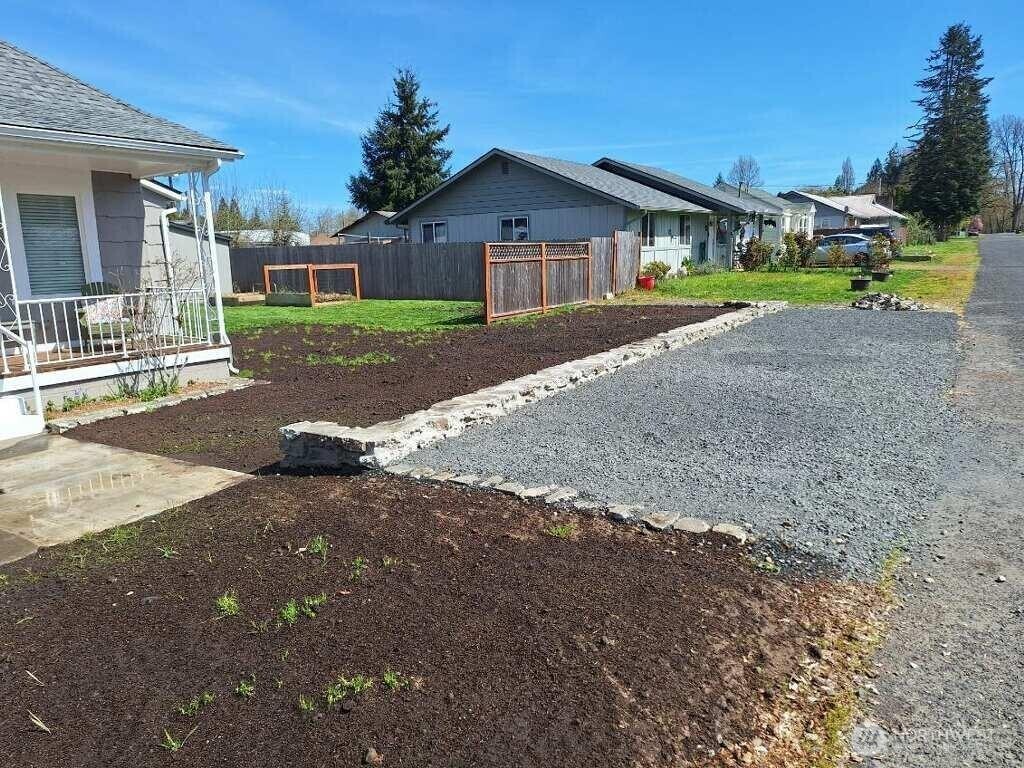 450 Cedar Street Toledo, WA 98591 - Photo 37 of 38 a front view of a house with a yard and pathway