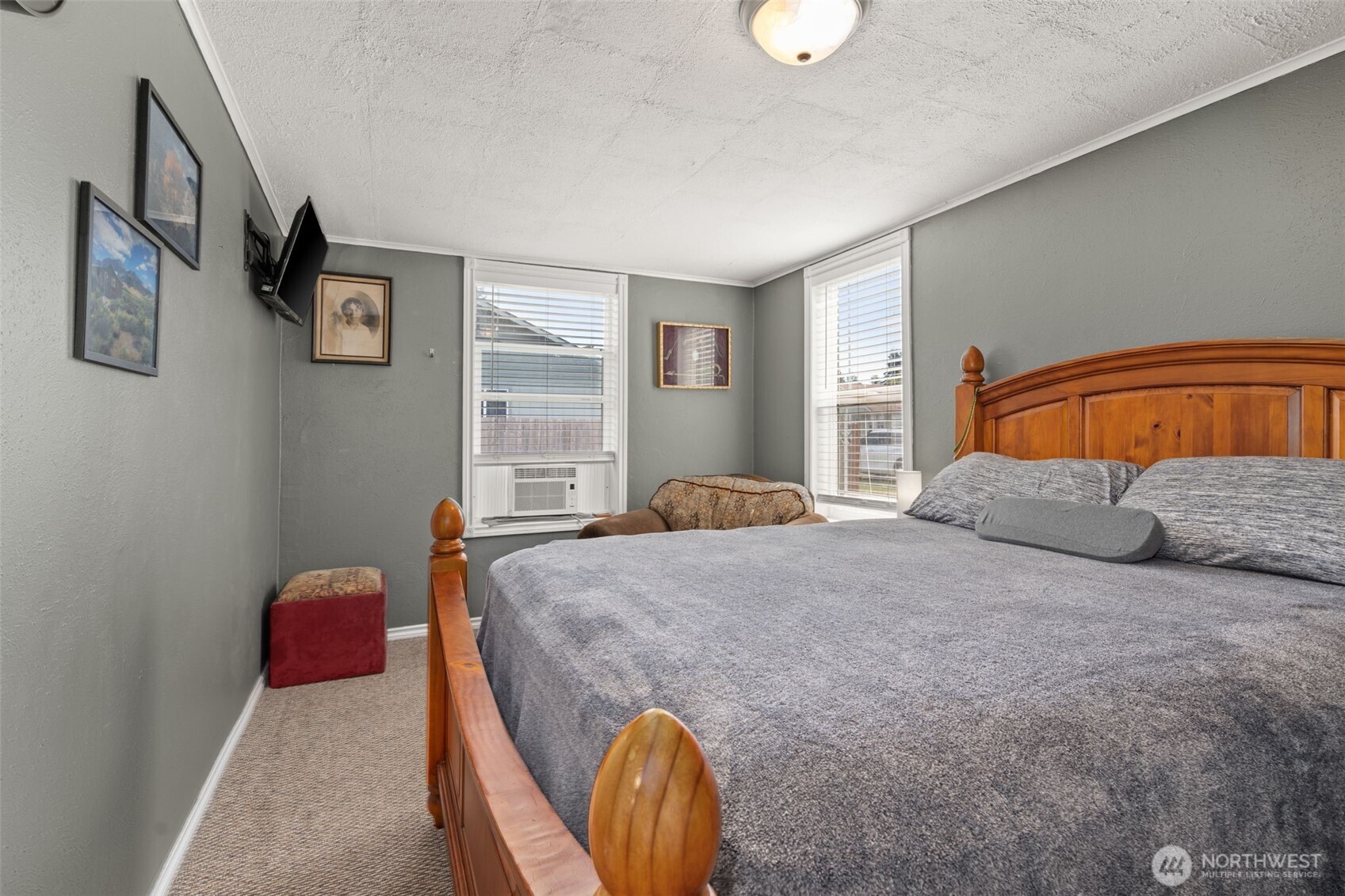 450 Cedar Street Toledo, WA 98591 - Photo 4 of 38 a bedroom with a bed and a chandelier