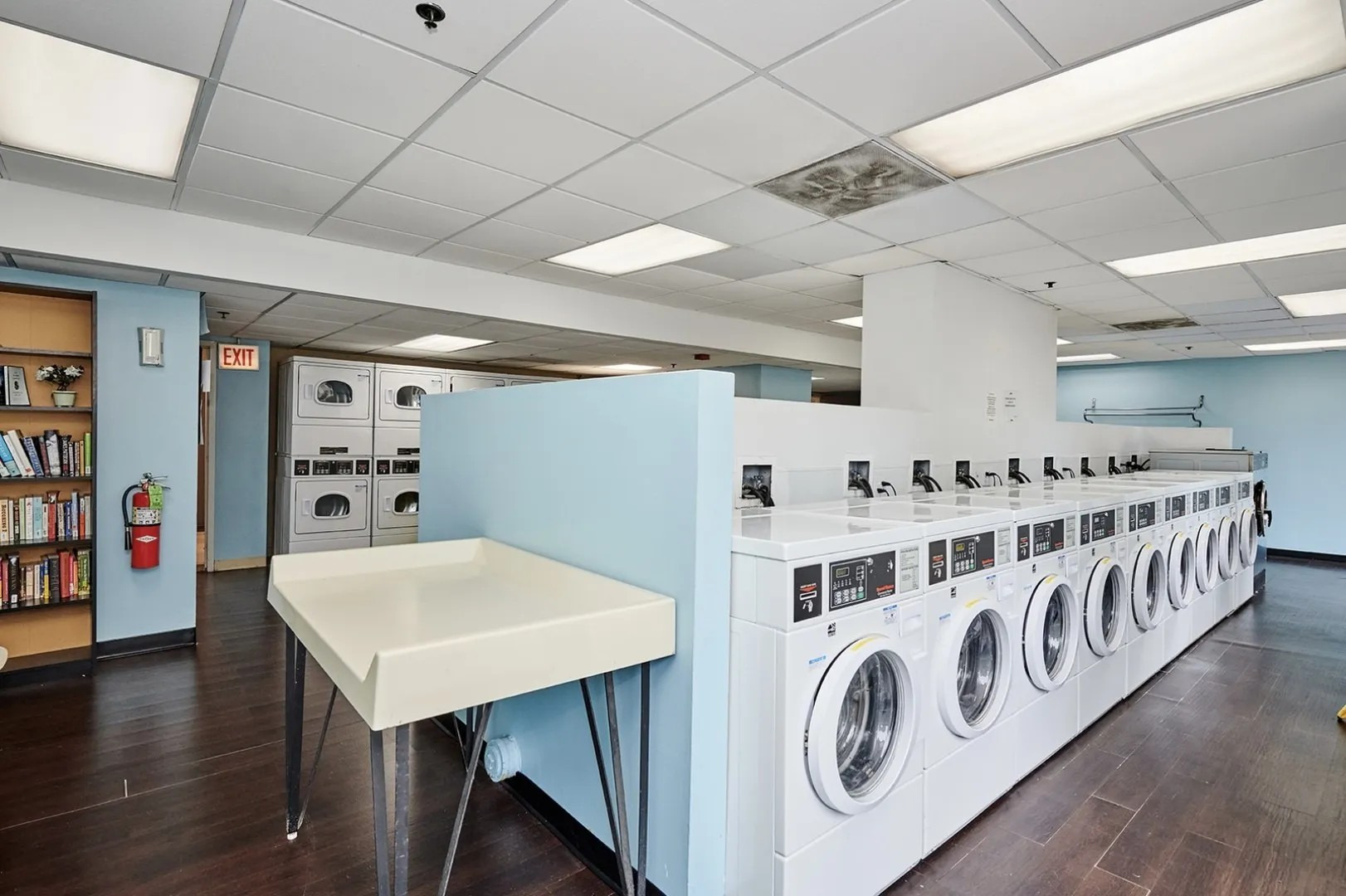200 North Dearborn Street, Unit 3402 Chicago, IL 60601 - Photo 15 of 18 a utility room with stainless steel appliances lots of counter space and wooden floor