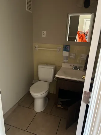 a bathroom with a toilet and a sink