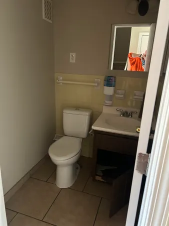 a bathroom with a toilet and a sink