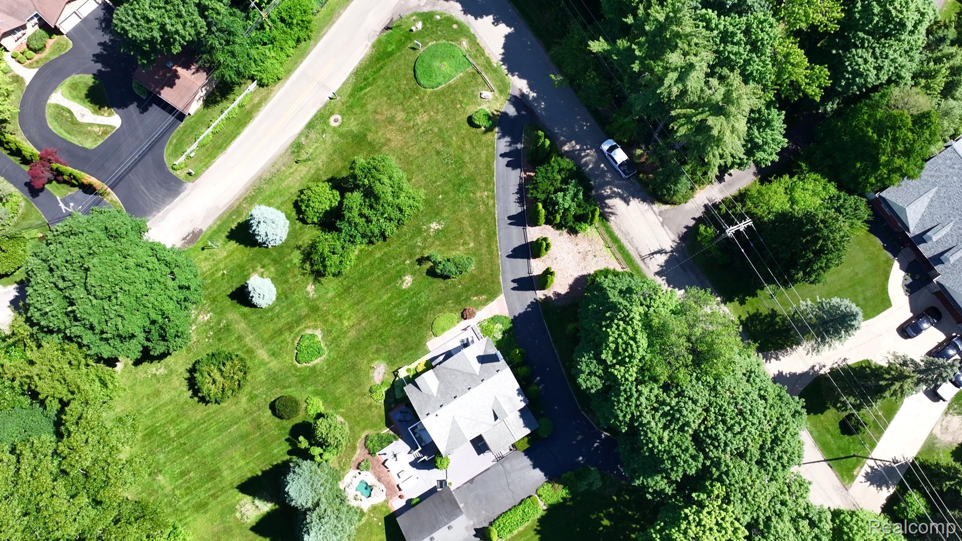 3841 Covert Road Waterford, MI 48328 - Photo 66 of 87 Expansive property featuring a large lawn, mature trees, and a residential street