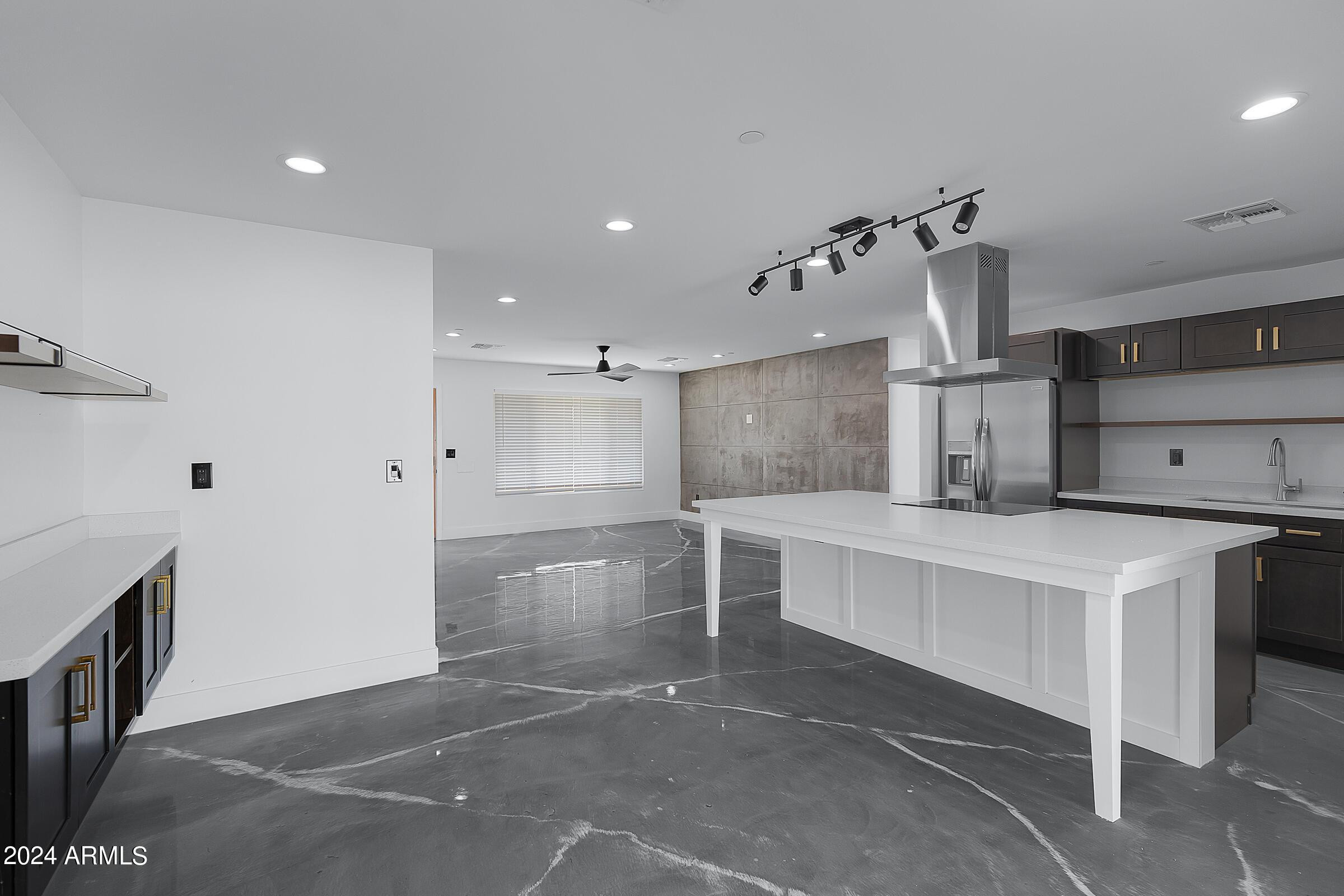 7308 East Granada Road Scottsdale, AZ 85257 - Photo 13 of 39 a large kitchen with a stove a refrigerator and a sink