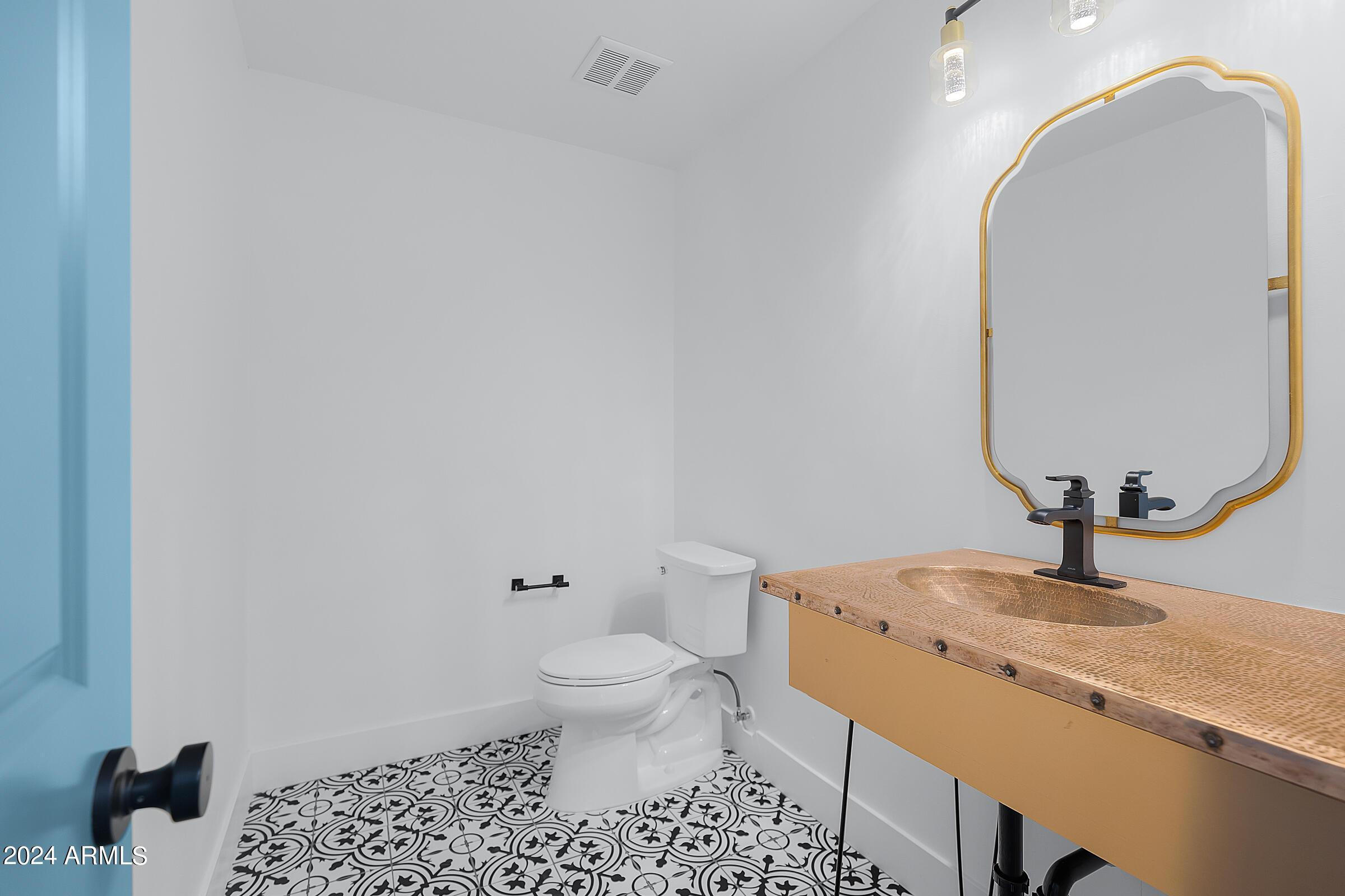 7308 East Granada Road Scottsdale, AZ 85257 - Photo 15 of 39 a bathroom with a granite countertop sink and a mirror