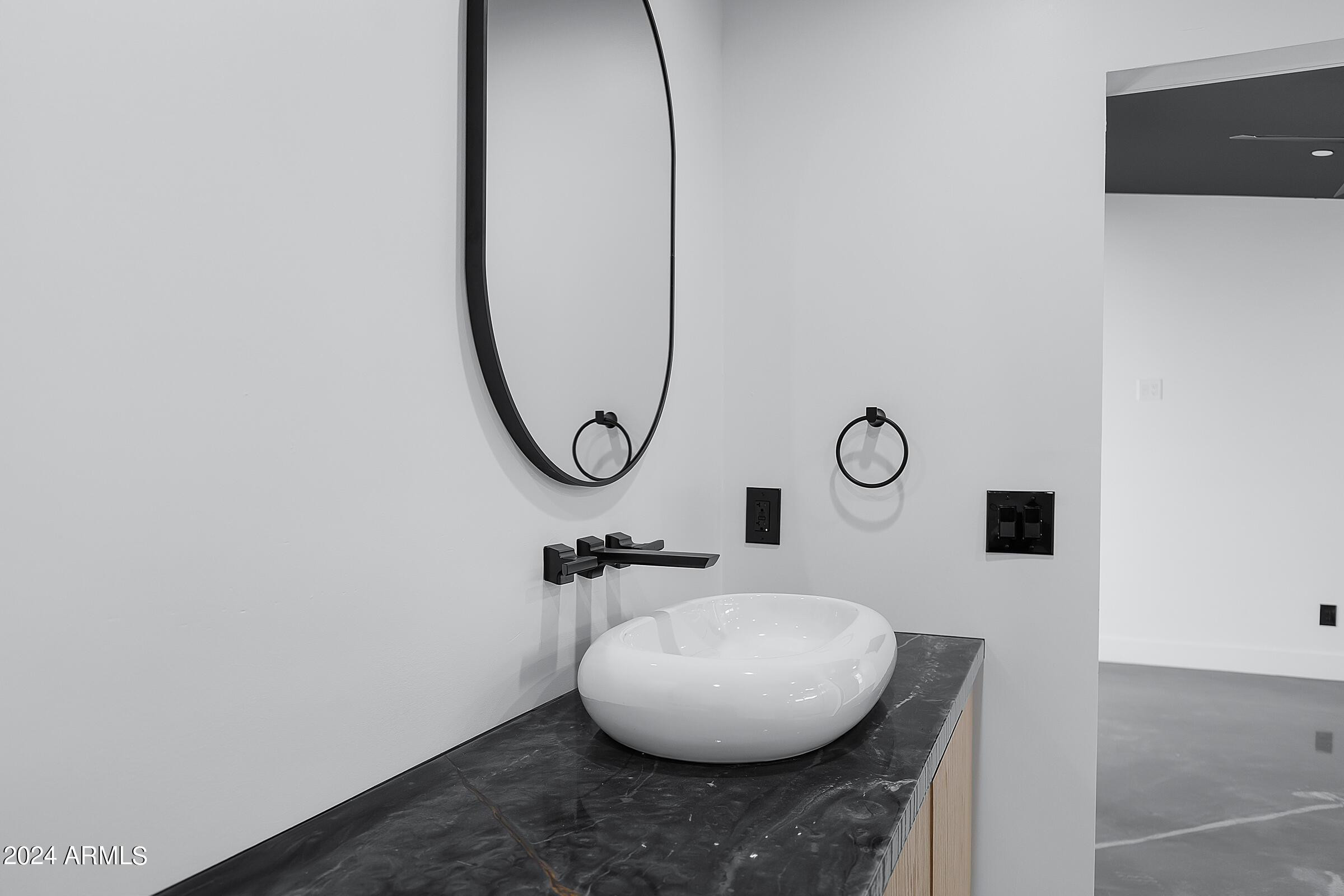 7308 East Granada Road Scottsdale, AZ 85257 - Photo 16 of 39 a bathroom with a mirror and a sink