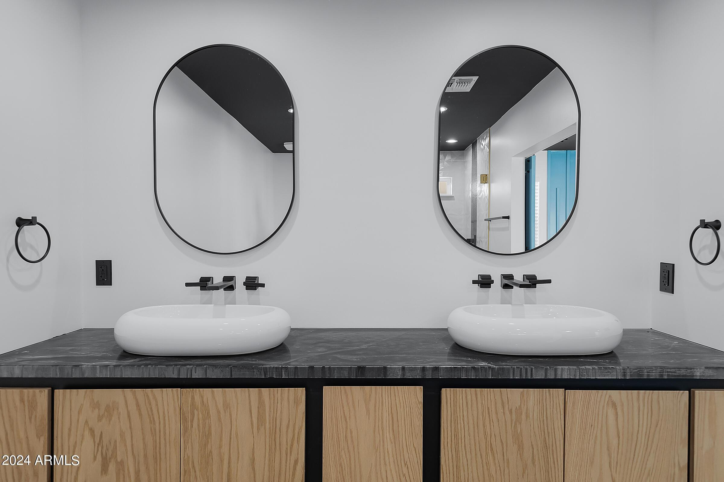 7308 East Granada Road Scottsdale, AZ 85257 - Photo 17 of 39 a bathroom with a double vanity sink and a mirror