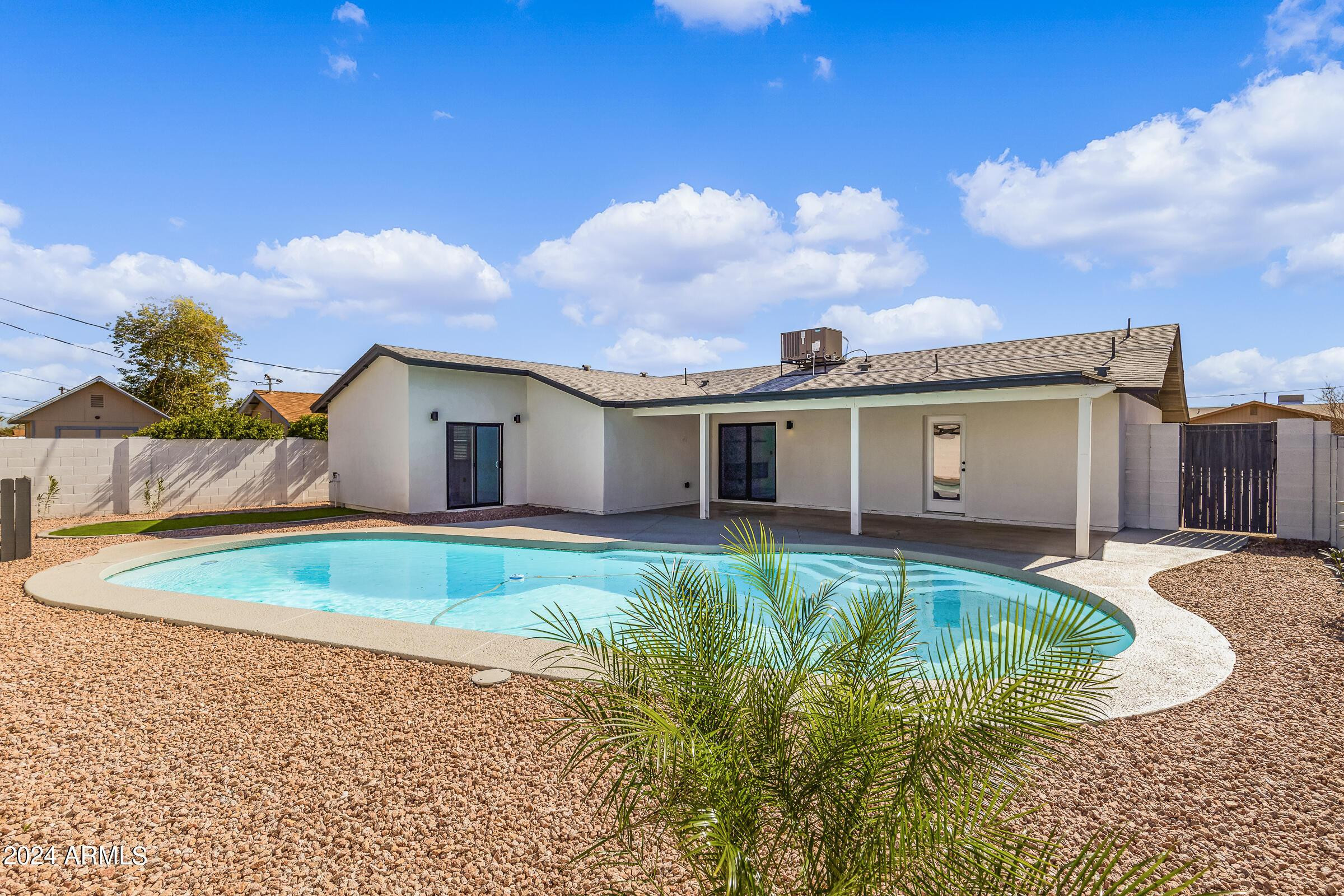 7308 East Granada Road Scottsdale, AZ 85257 - Photo 2 of 39 a front view of a house with garden