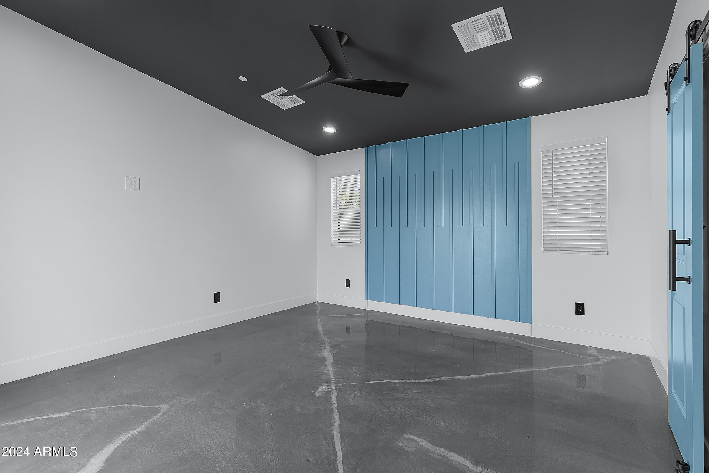 7308 East Granada Road Scottsdale, AZ 85257 - Photo 21 of 39 an empty room with projector and windows