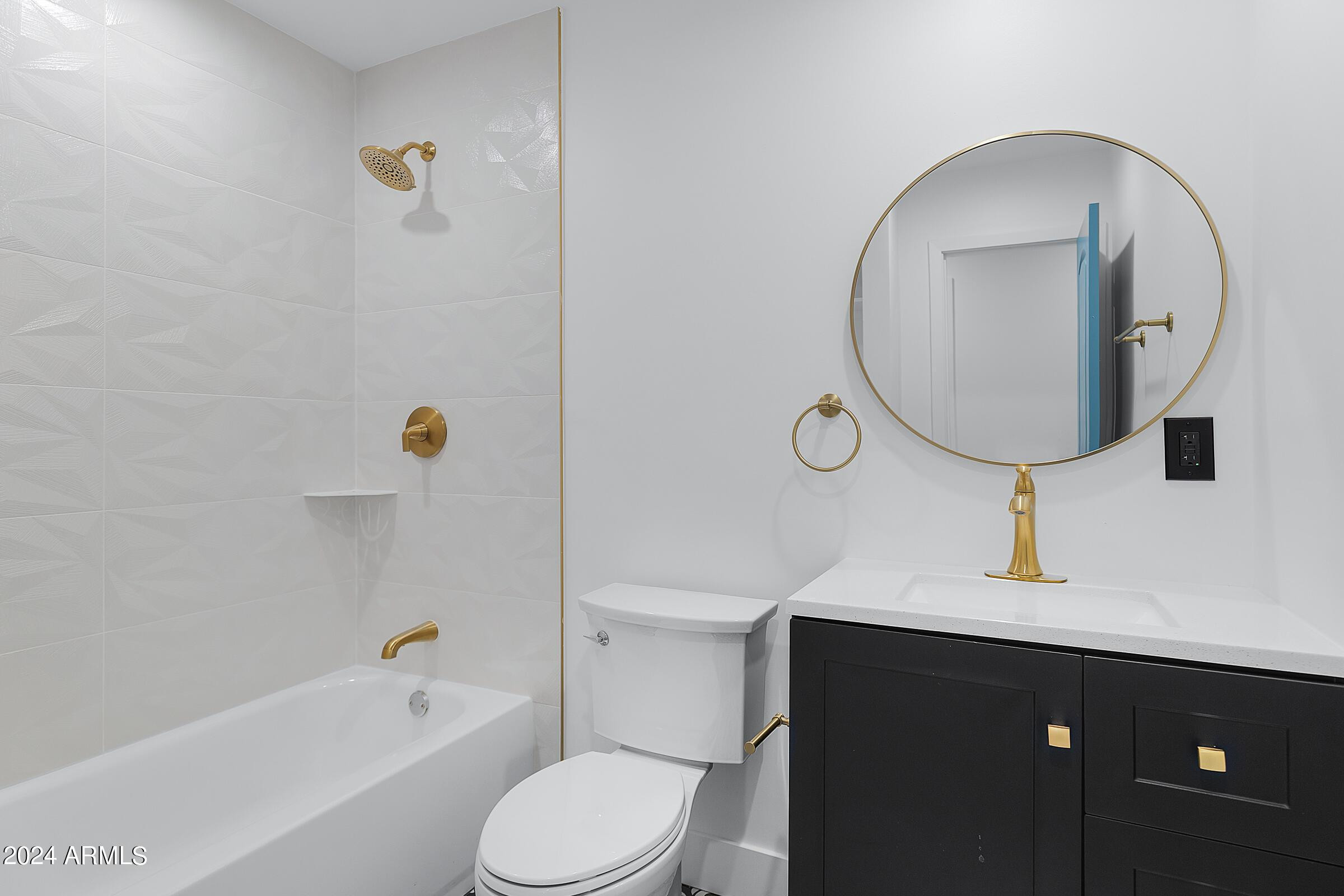 7308 East Granada Road Scottsdale, AZ 85257 - Photo 23 of 39 a bathroom with a sink a toilet and bathtub