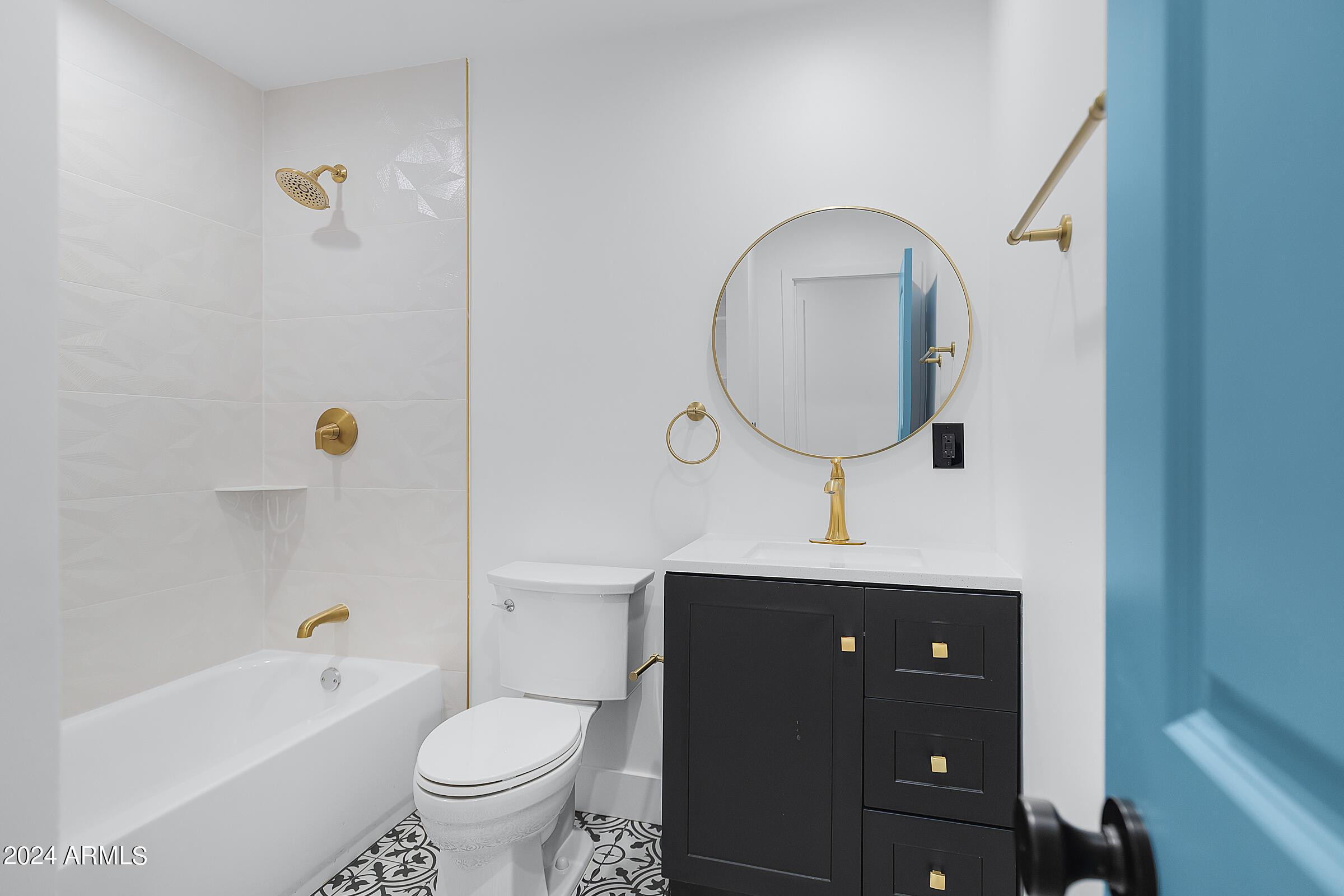 7308 East Granada Road Scottsdale, AZ 85257 - Photo 24 of 39 a bathroom with a toilet a sink and mirror