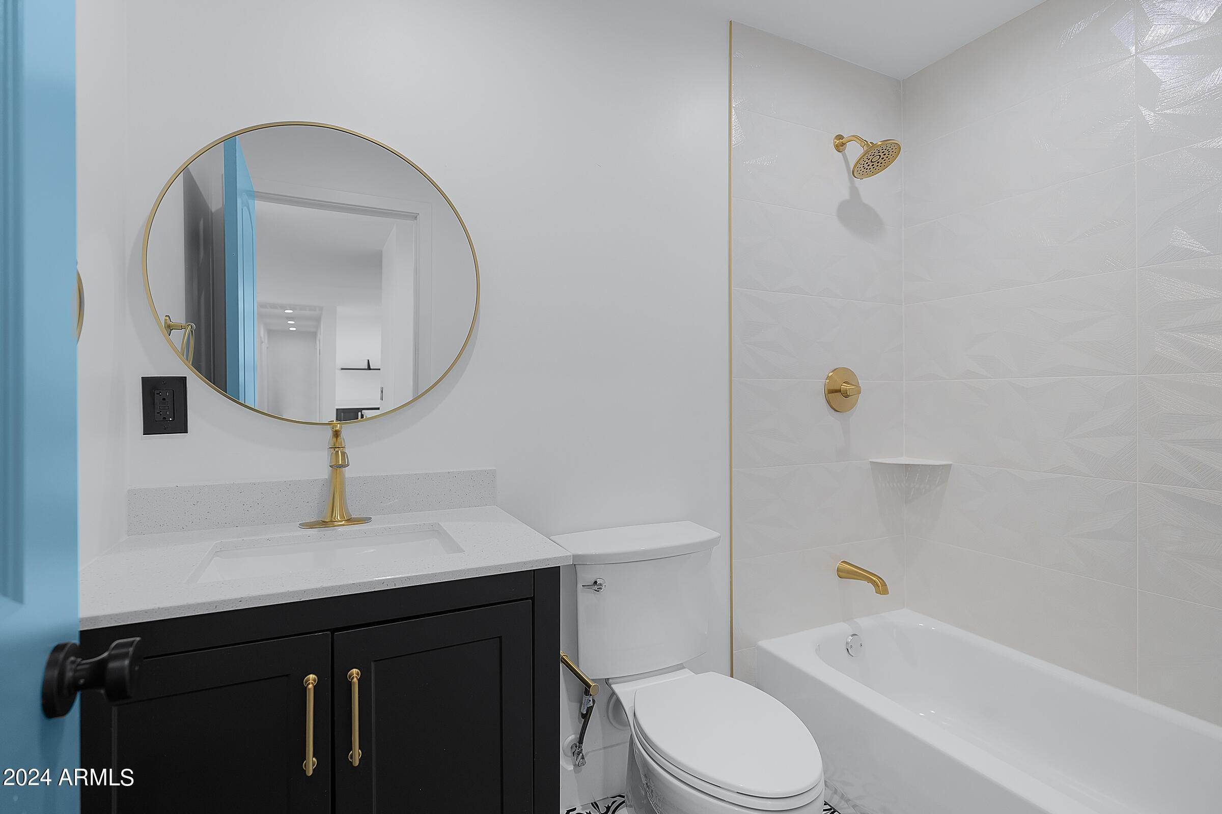 7308 East Granada Road Scottsdale, AZ 85257 - Photo 25 of 39 a bathroom with a sink a toilet and bathtub