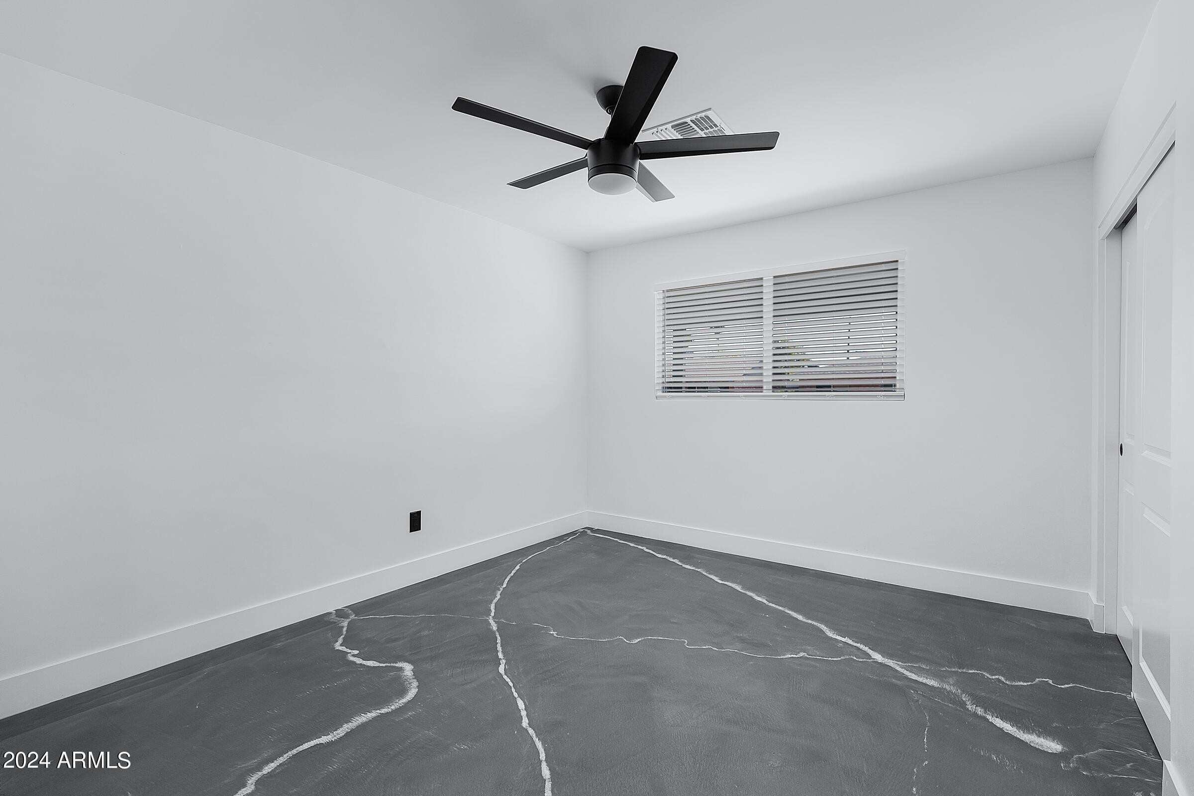 7308 East Granada Road Scottsdale, AZ 85257 - Photo 28 of 39 a view of a room with a ceiling fan and wooden floor