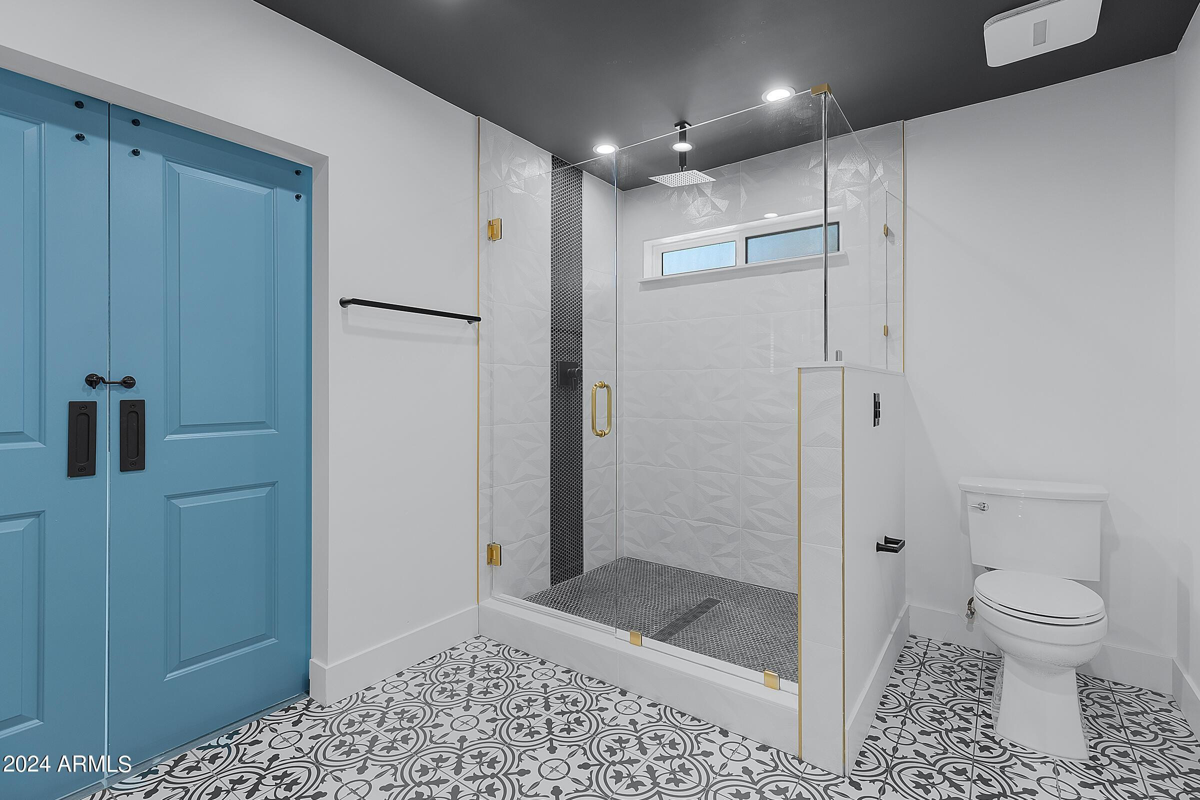 7308 East Granada Road Scottsdale, AZ 85257 - Photo 3 of 39 a bathroom with a shower a toilet and a sink