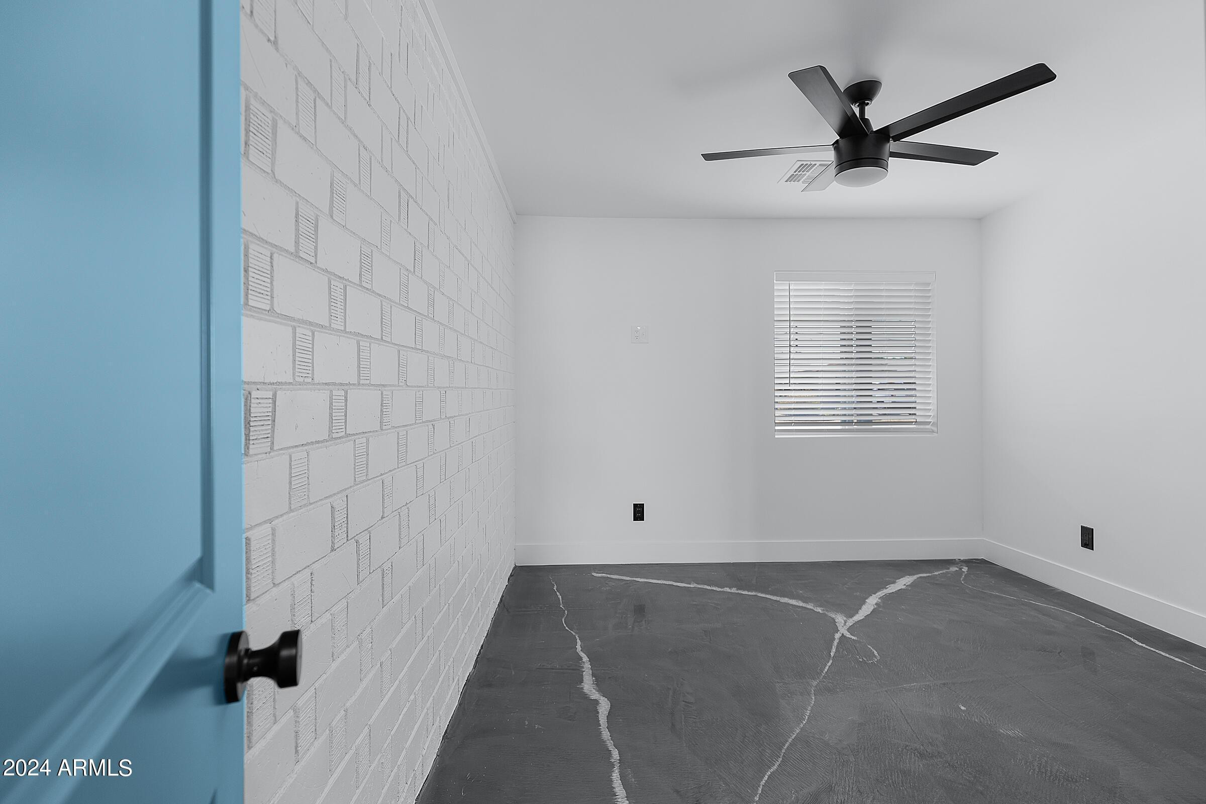 7308 East Granada Road Scottsdale, AZ 85257 - Photo 32 of 39 a view of a livingroom with a ceiling fan and window